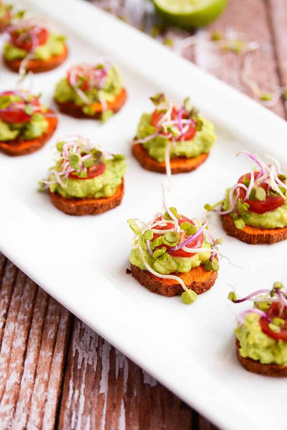 Little potato and avocado bites on a rectangular white serving plate - Blissful Basil