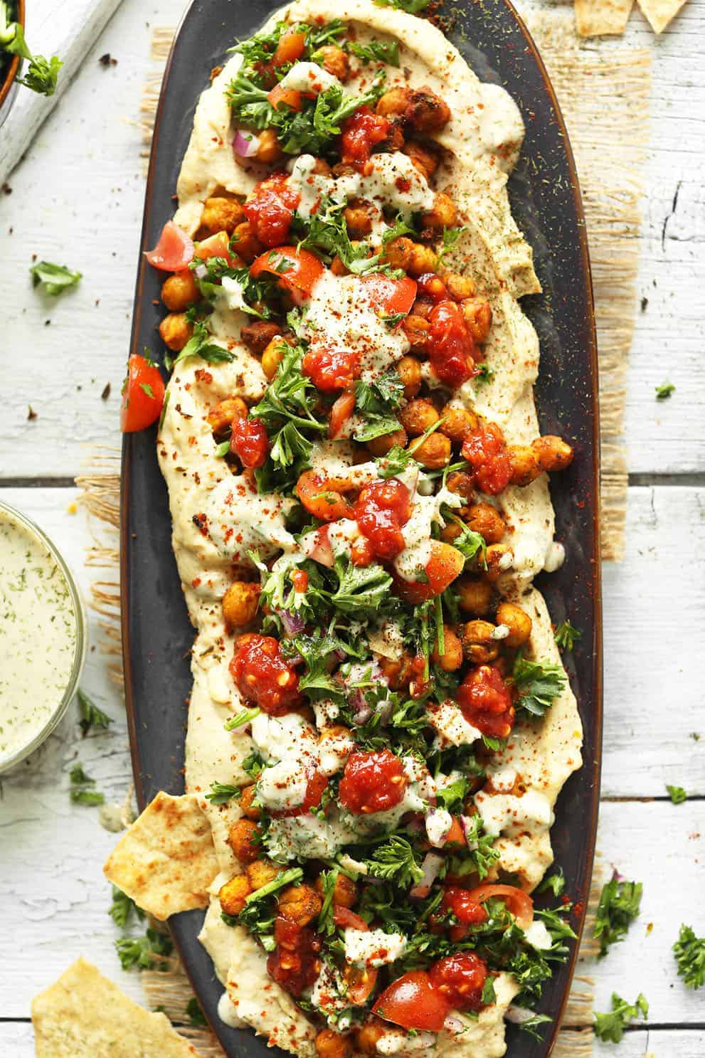 Chickpea shawarma dip served on an oval black tray - Minimalist Baker