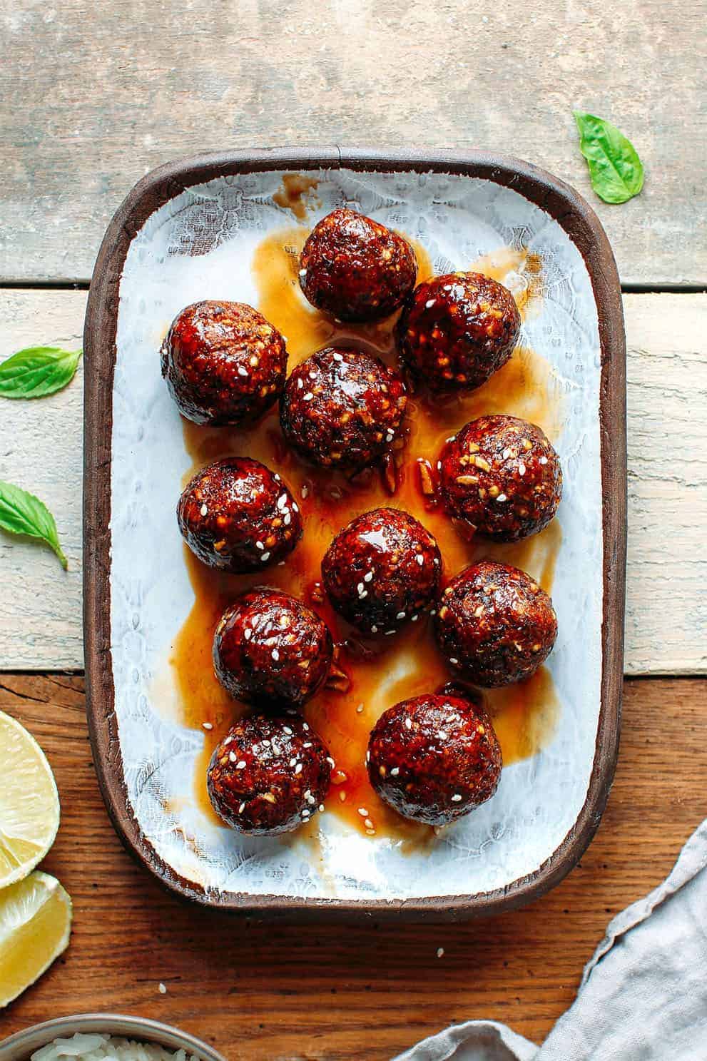 Vegan tender teriyaki meatballs on a rectangular light blue plate - Full of Plants