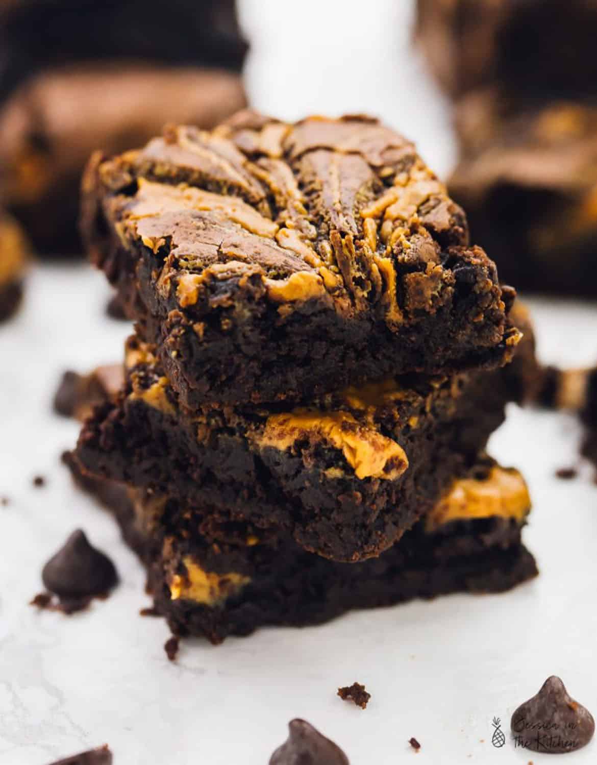  VEGAN CHOCOLATE PEANUT BUTTER SWIRL BROWNIES over a white background - Jessica in the kitchen