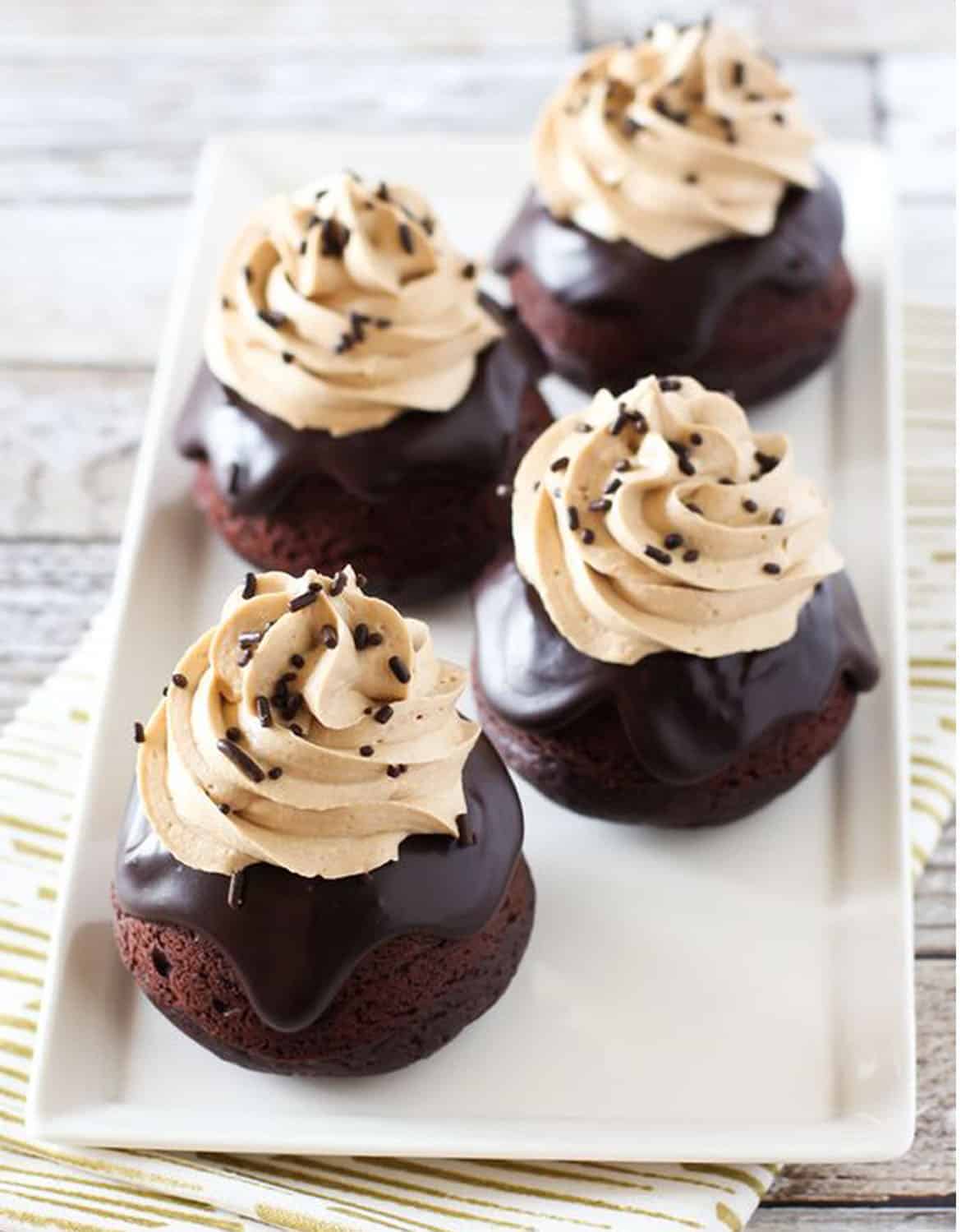 Four vegan dark chocolate mocha mini cakes on a white tray - Sarah Bakes Gluten Free