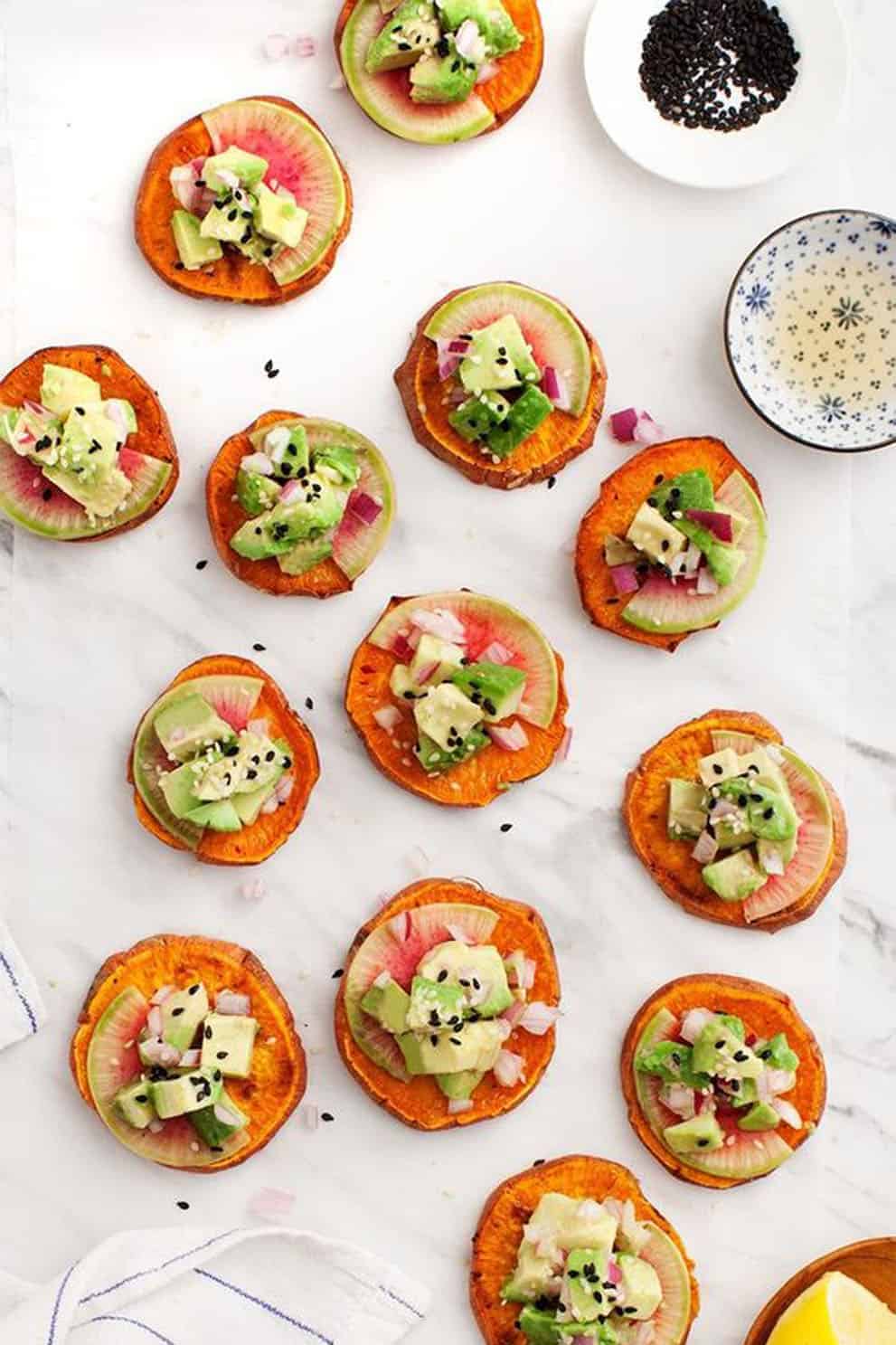 Sweet potato avocado tartare canapés in a white background - Love and Lemons