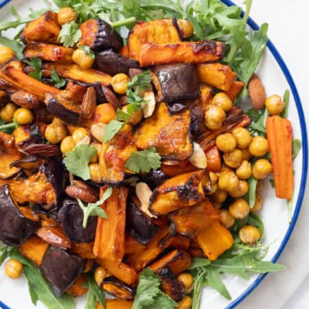 Harissa eggplant carrot salad with chickpeas and arugula.