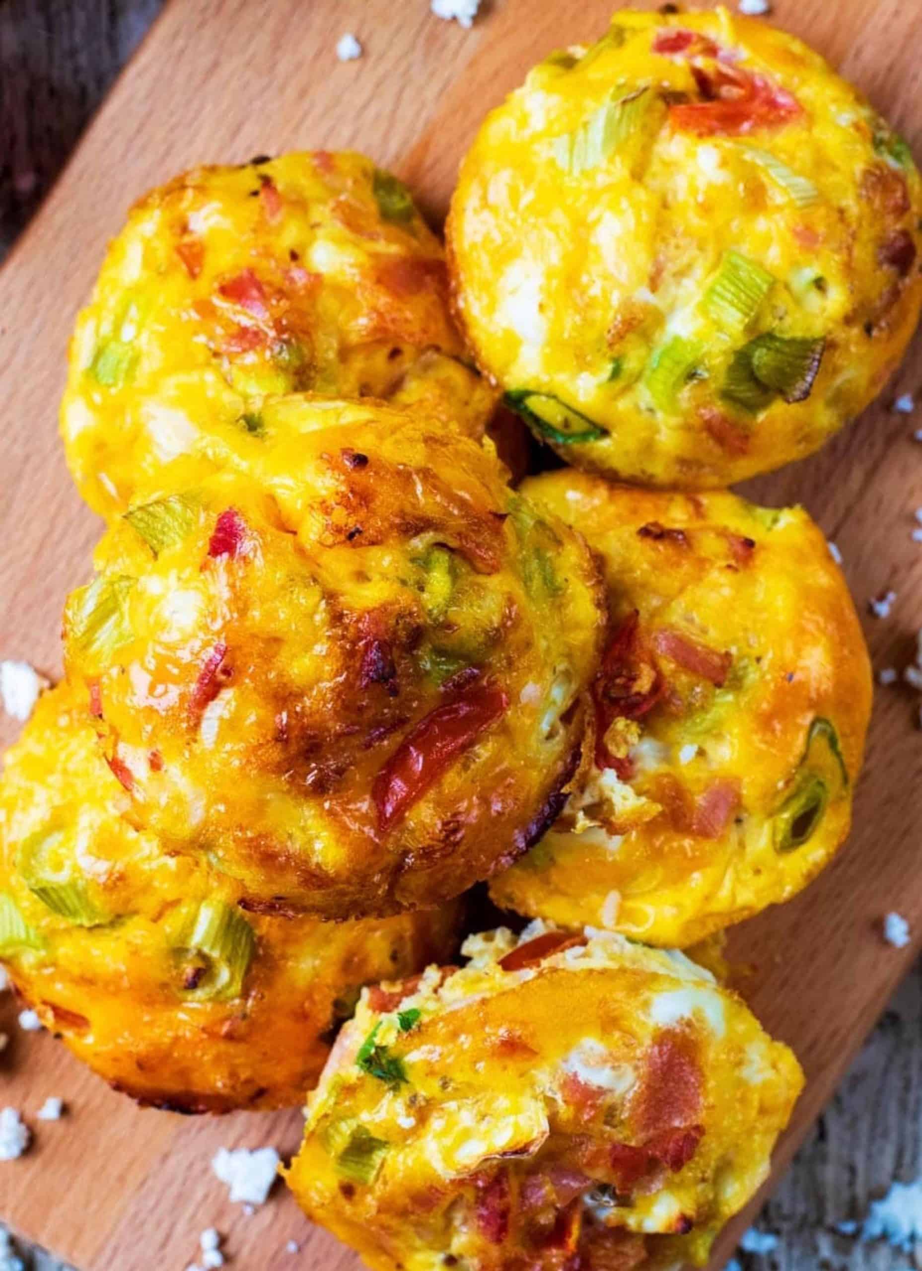 Six egg muffins over a wooden board - Healthy Hungry Happy.