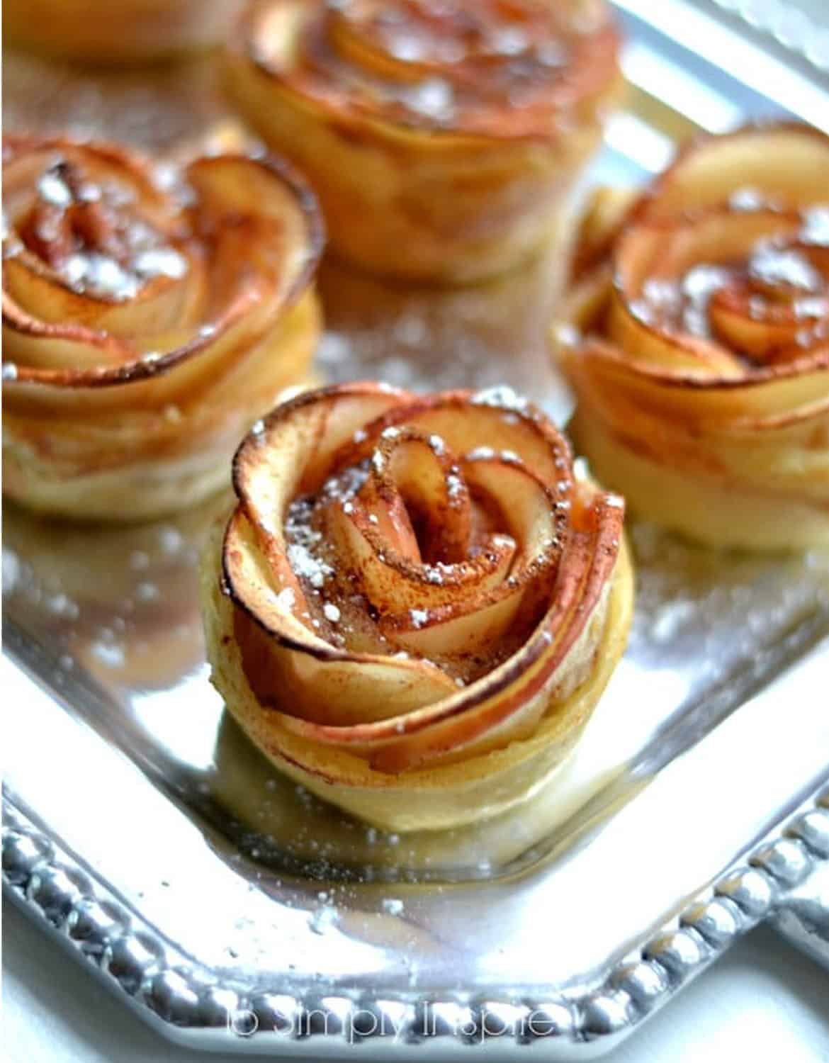 Apple rose puffed pastries on a silver tray - To Simply Inspire
