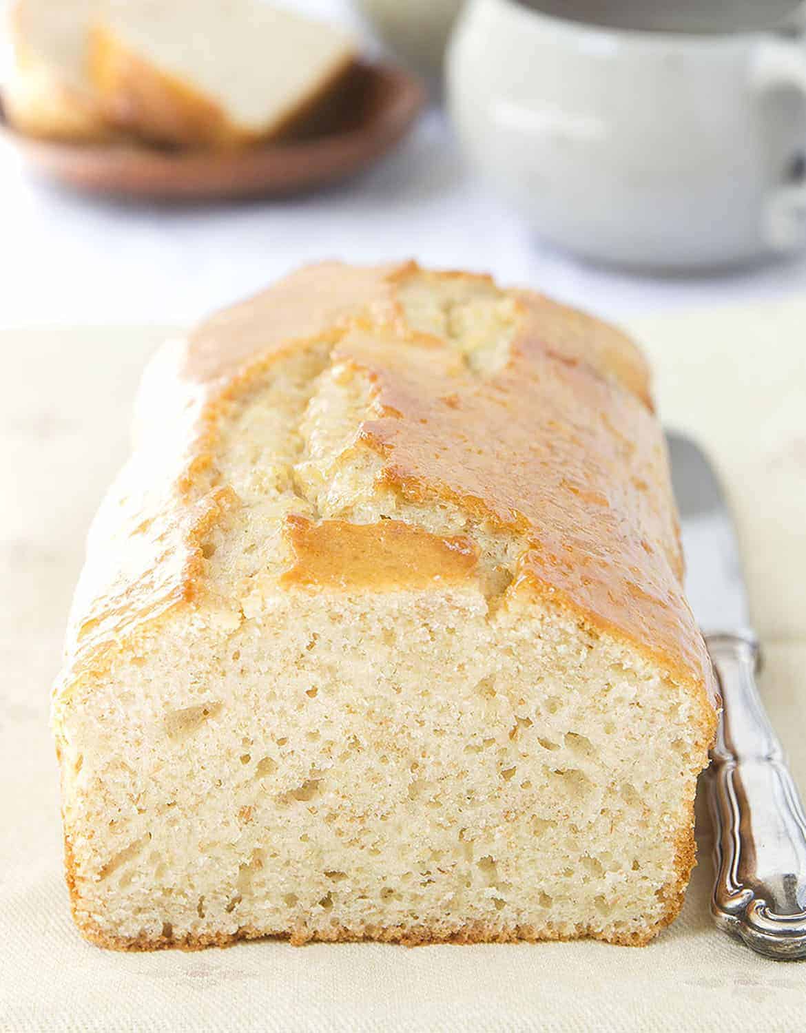 Healthy yogurt cake on a cream napkin with a knife - The Clever Meal