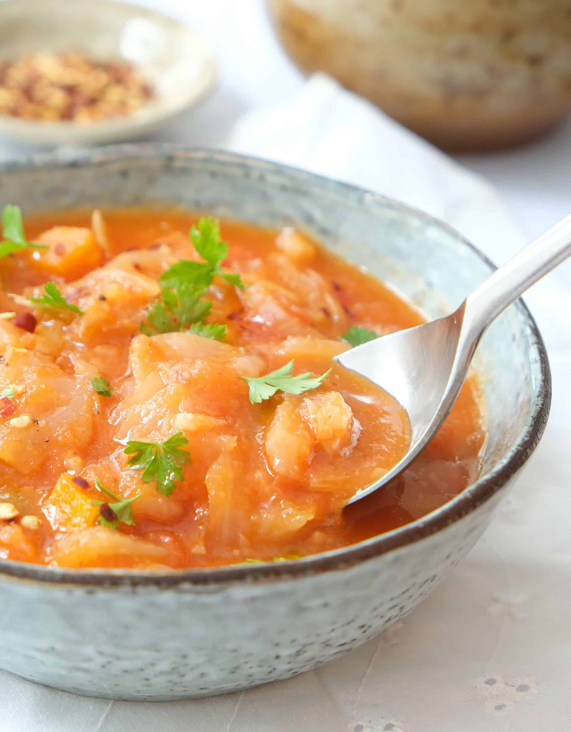 Close-up of a bowl full of cabbage soup.