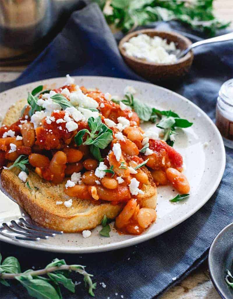 Tomato and cannellini beans with feta on a toast - Running to The Kitchen