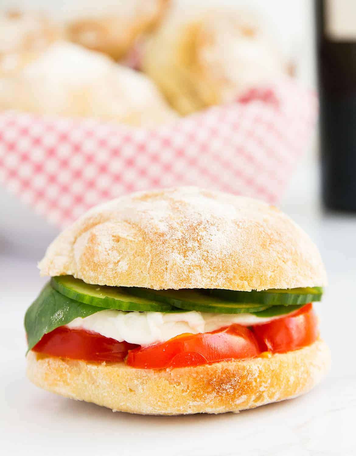 Authentic Italian panini bread stuffed with tomatoes, mozzarella, basil and cucumber.