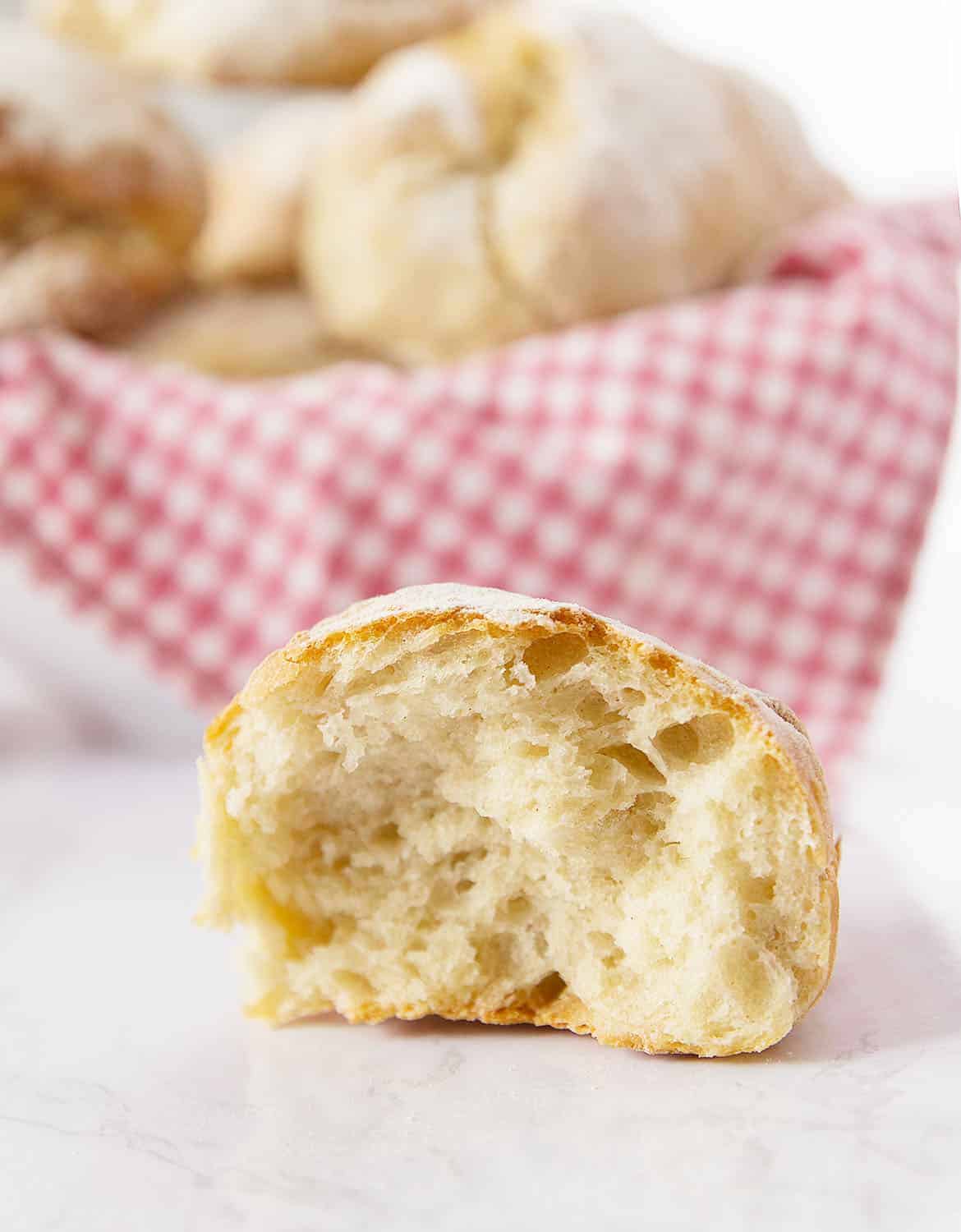 Half panino bread shows its crusty outside and soft inside.