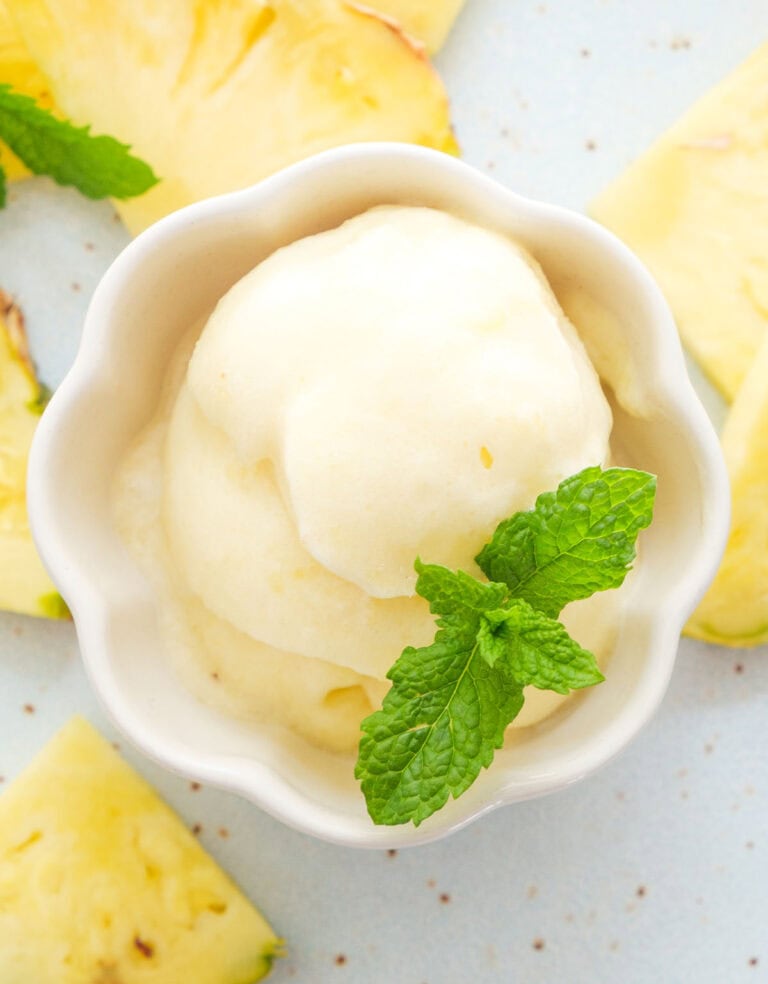 Top view of a small bowl with pineapple sorbet.