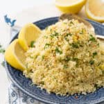 Lemon couscous on a blue plate.