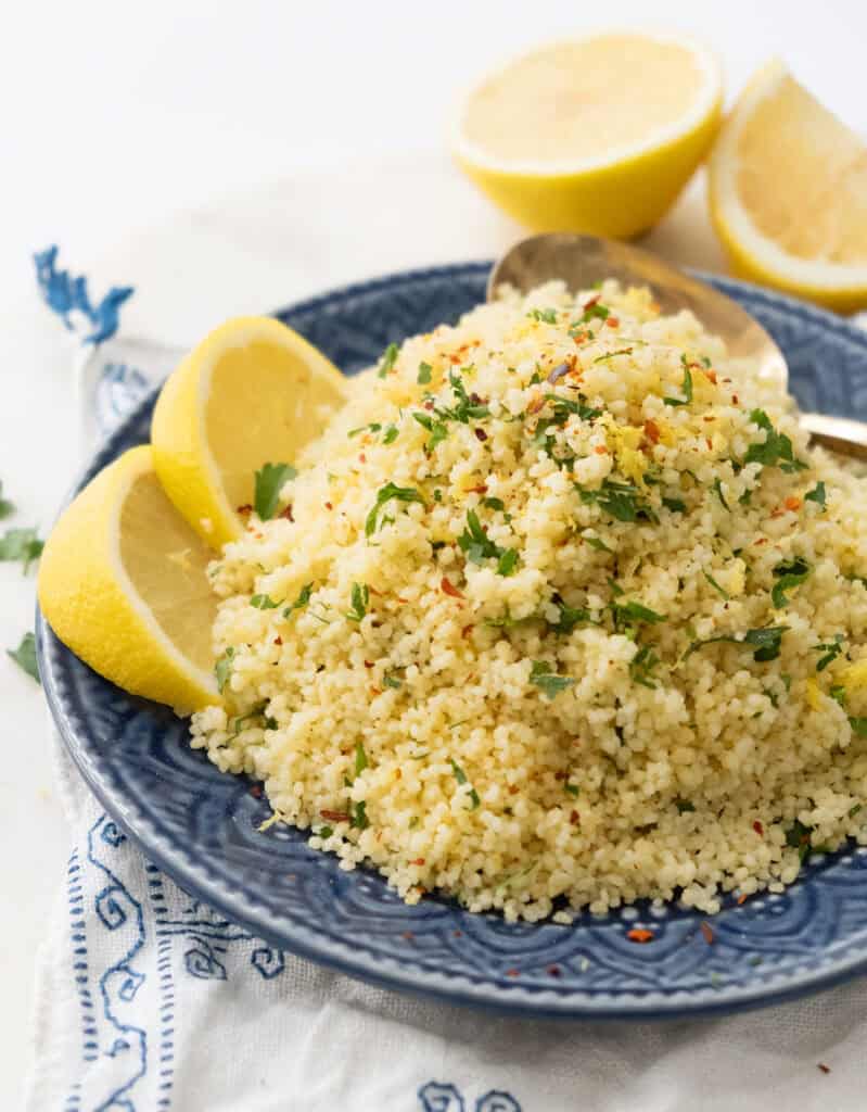 Lemon couscous salad on blue plate.