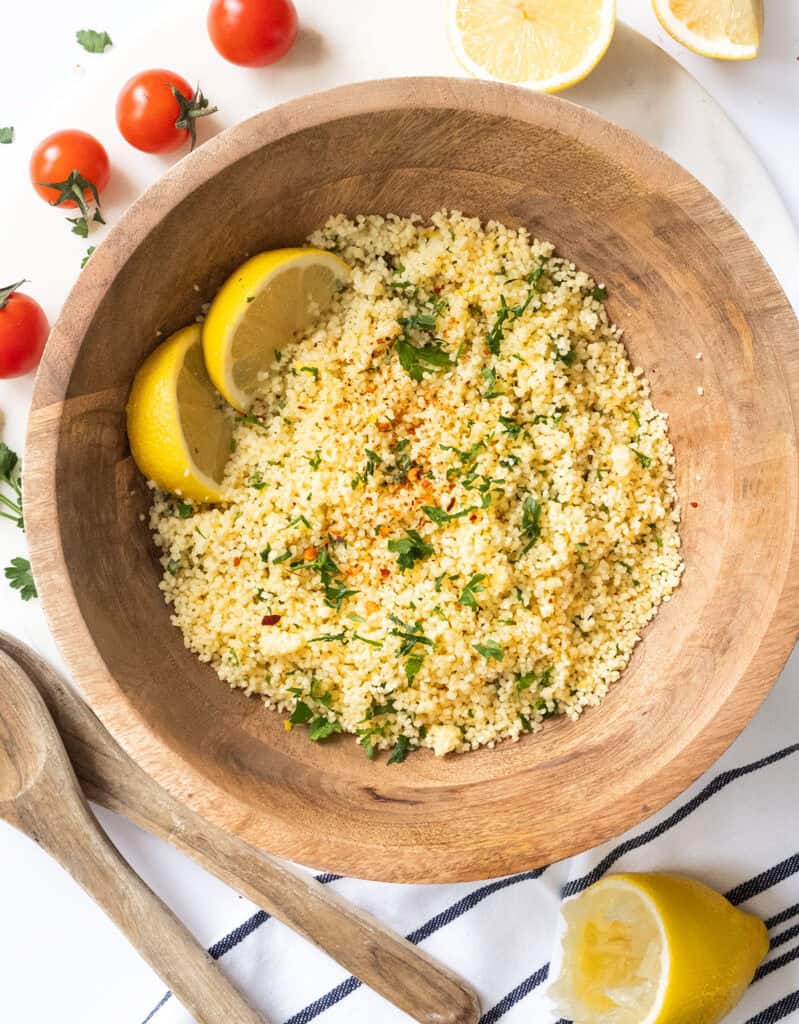 Lemon couscous salad in wooden bowl.