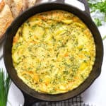 Top view of a cast iron pan with potato frittata.