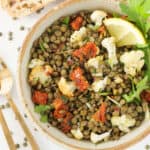 Top view of a bowl full of green lentil salad.