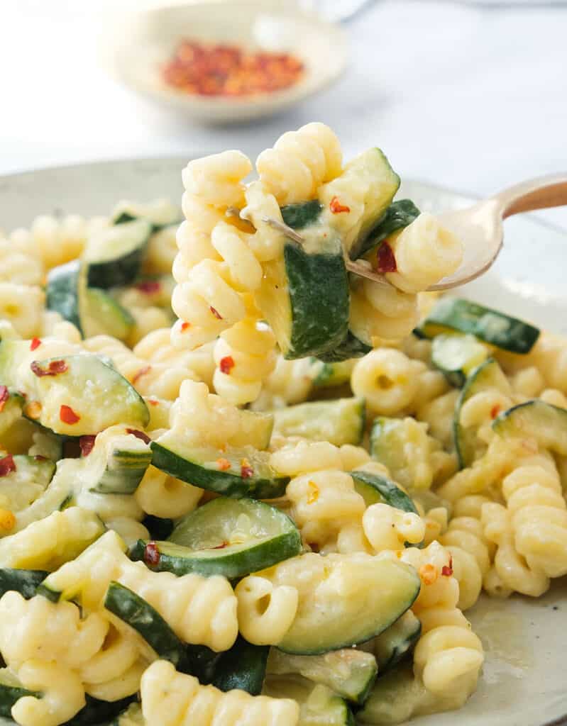 Close-up of a dish full of quick pasta with zucchini.