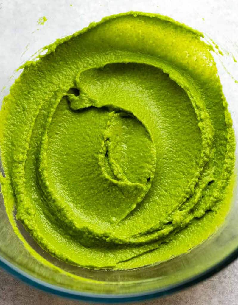 Top view of a bright green pea puree, one of these easy pea recipes.