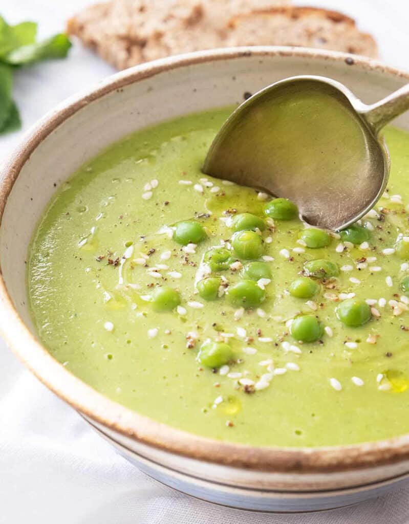 Close-up of a bowl full of creamy pea soup, another delicious easy pea recipe.