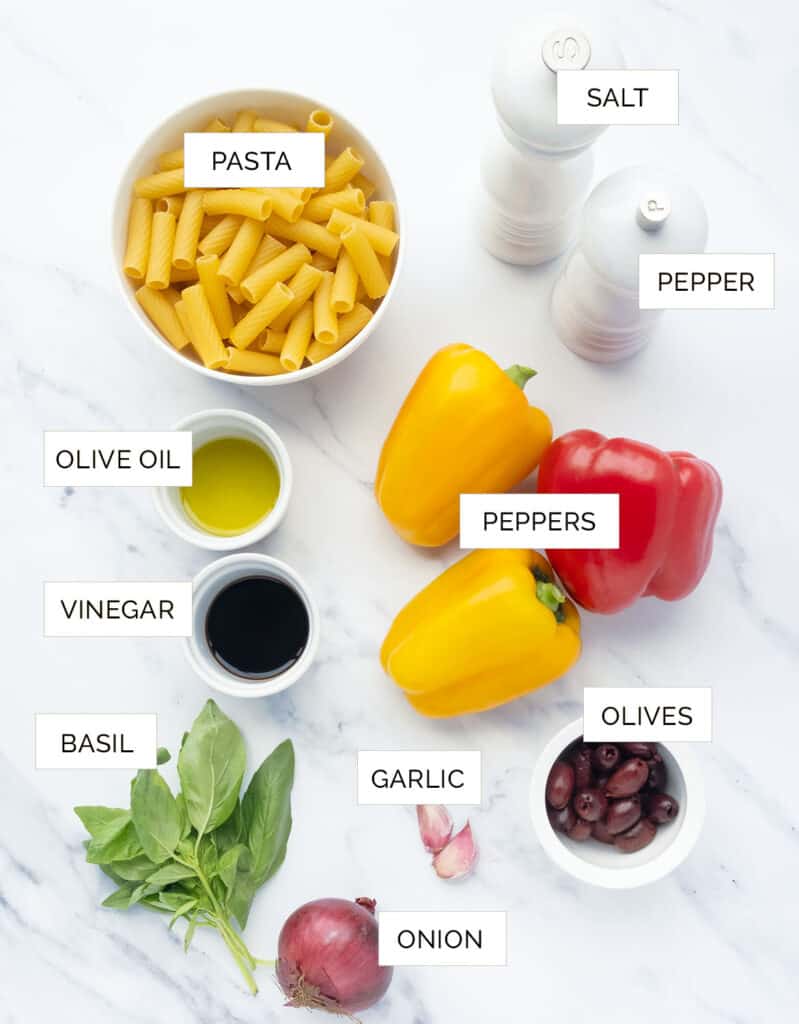 The ingredients to make this pasta with peppers are arranged over a white background.