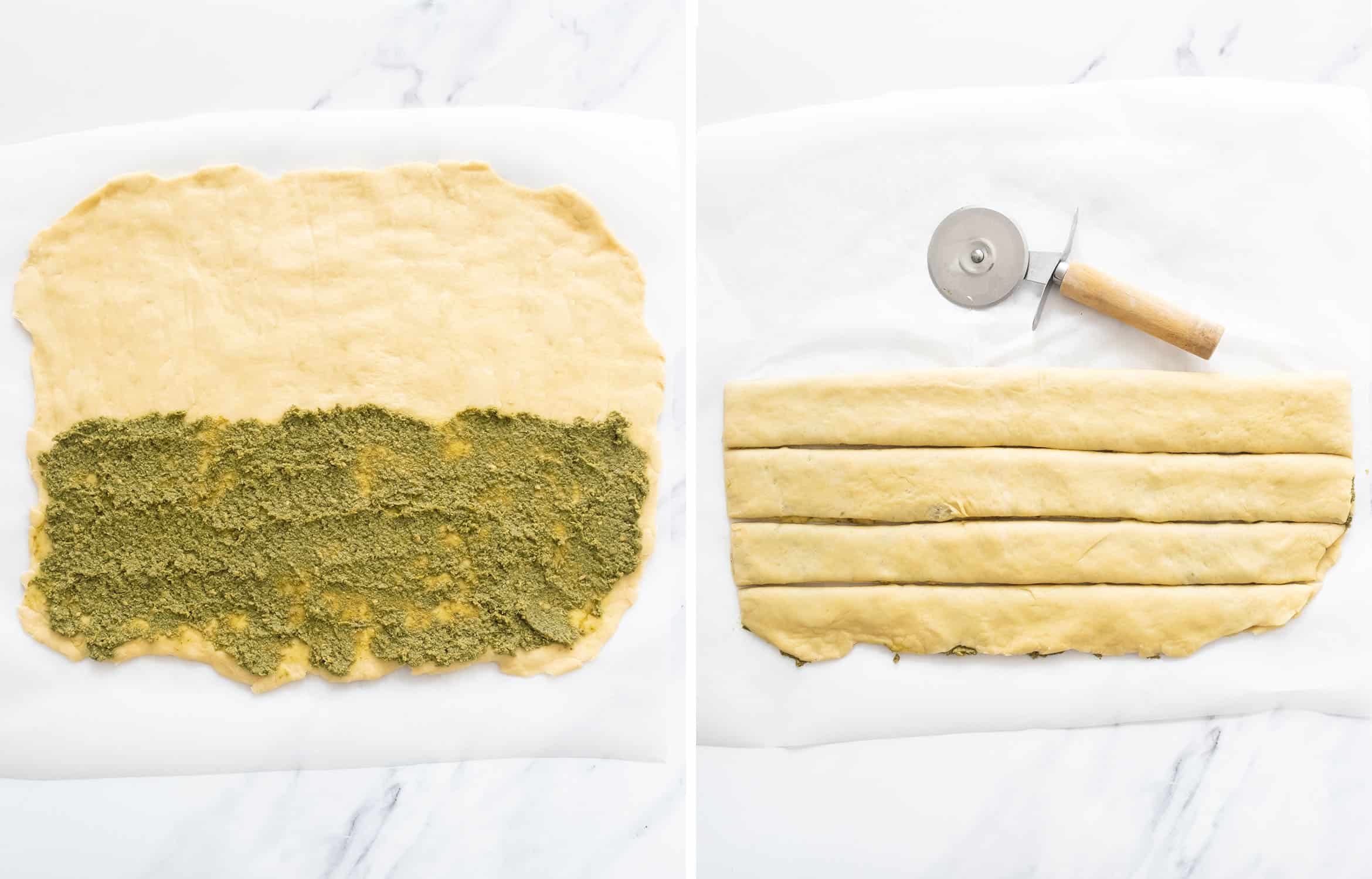 Top view of the pesto bread dough flatten and covered with a layer of garlicky pesto, and cut into four slices with a pizza cutter.