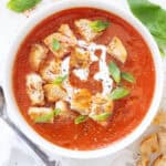 Top view of an easy tomato soup in a white bowl.