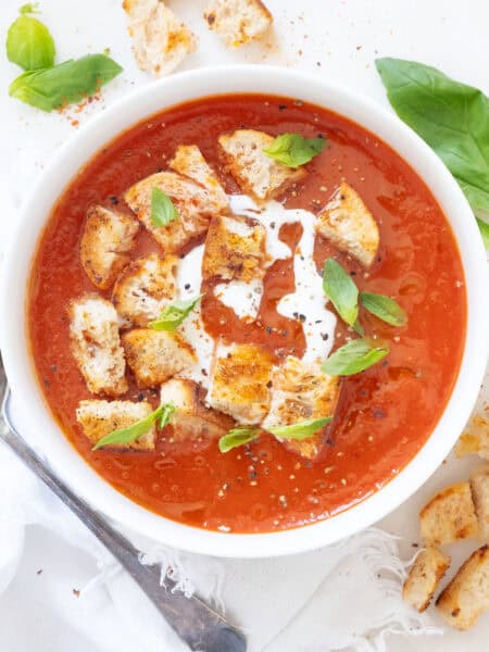 Top view of an easy tomato soup in a white bowl.
