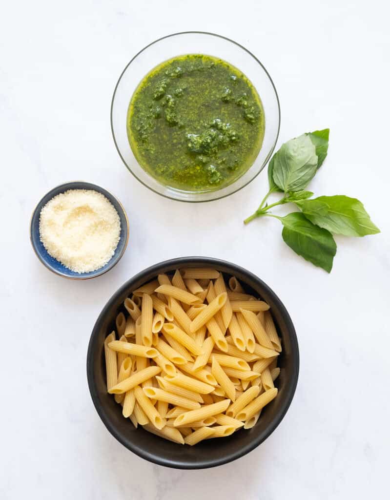 Top view of the ingredients to make penne with pesto.