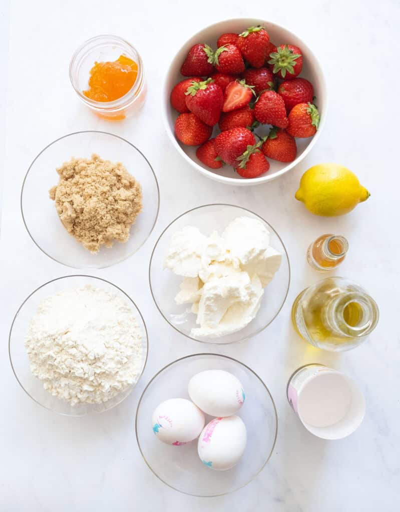 Top view of the ingredients to make this strawberry ricotta cake.