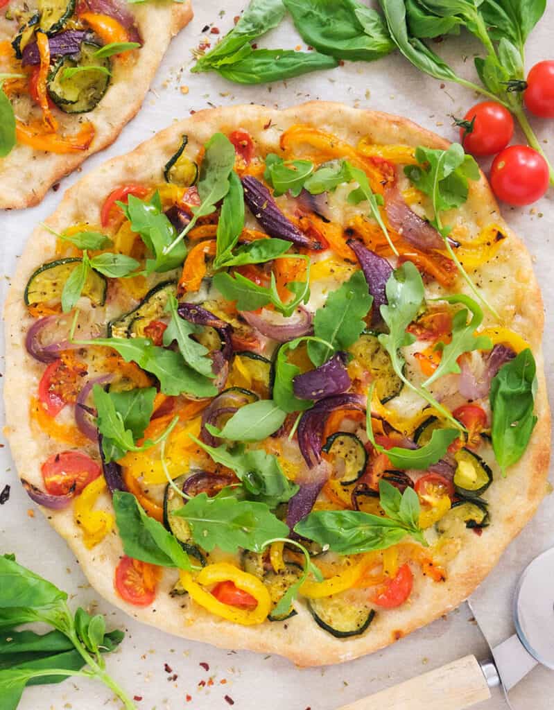 Top view of a round artichoke pizza, one of our favorite vegetarian pizza recipes.