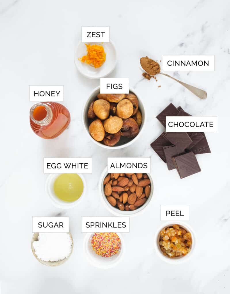 The ingredients to make the Italian Christmas fig cookies are arranged over a white background.