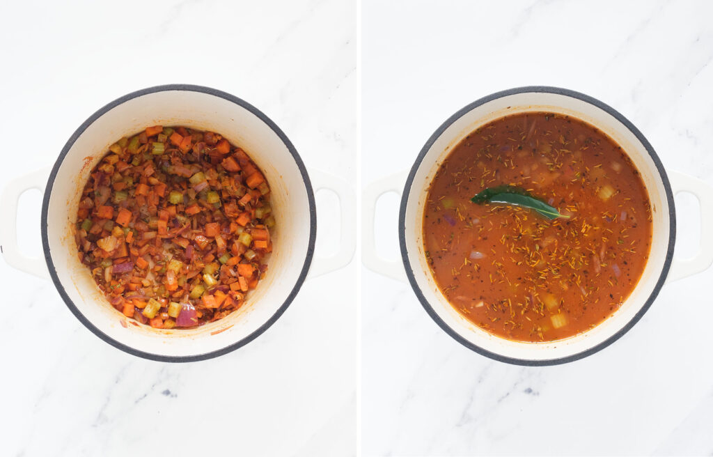 Top view of white cast iron full of vegetables, beans and tomato broth.