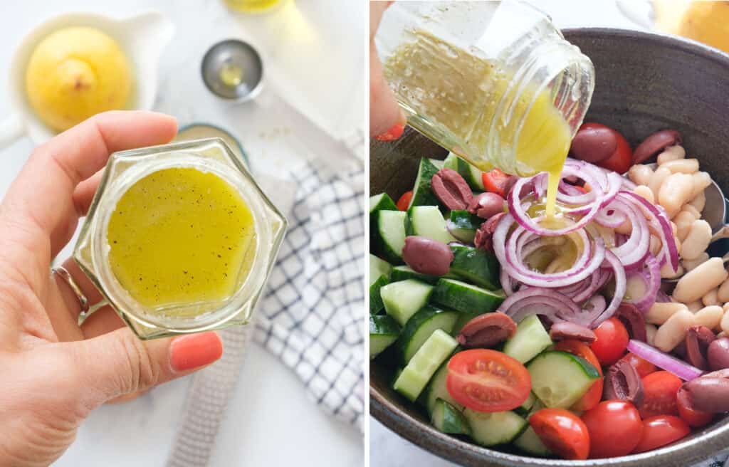 A hand holding the glass jar full of lemon garlic dressing.