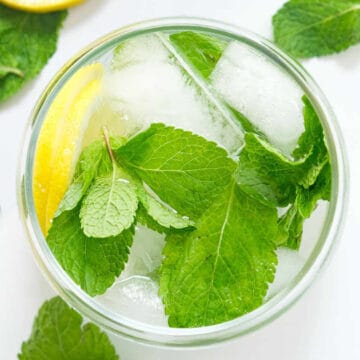 Top view of a glass full of mint water.
