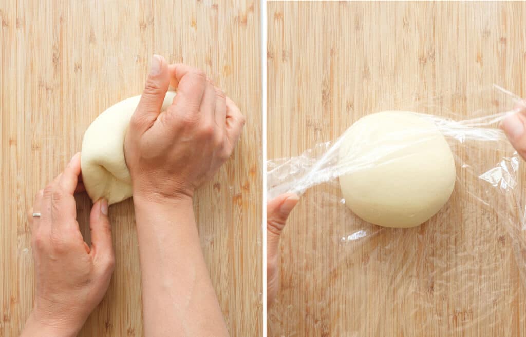 Top op view of two hands kneading and wrapping the dough in cling film.