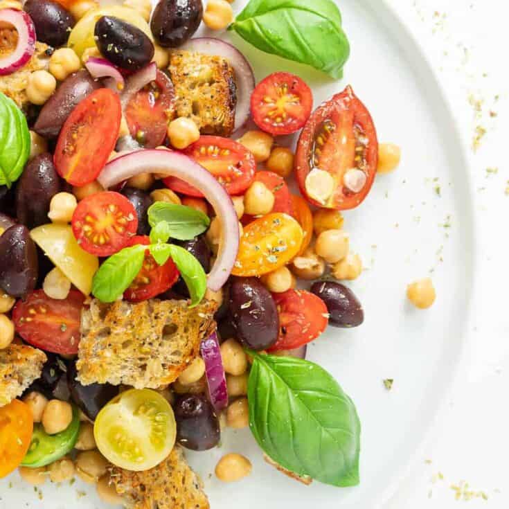 Panzanella salad over a white plate.
