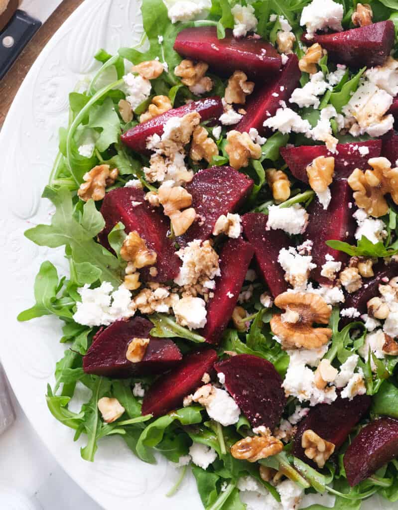 Close-up of a the beet salad recipe showing the juicy beets, the creamy feta and nutty walnuts.