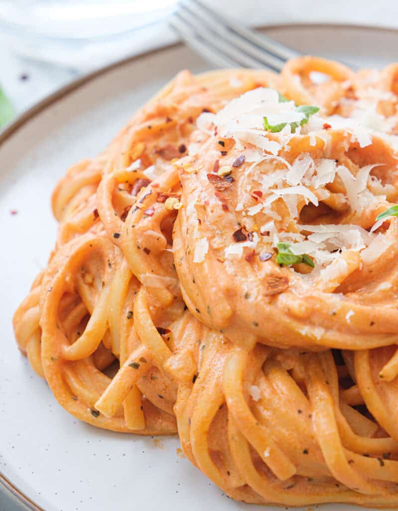 Close-up of some creamy, luscious linguine with tomato pasta sauce with cream cheese.
