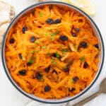 Carrot raisin salad in a bowl.