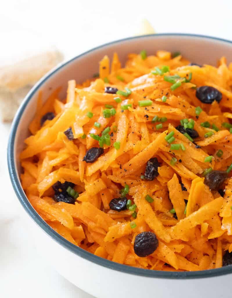Carrot raisin salad in a bowl.