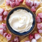 Top view of a small blue bowl full of sweet cream cheese recipe.