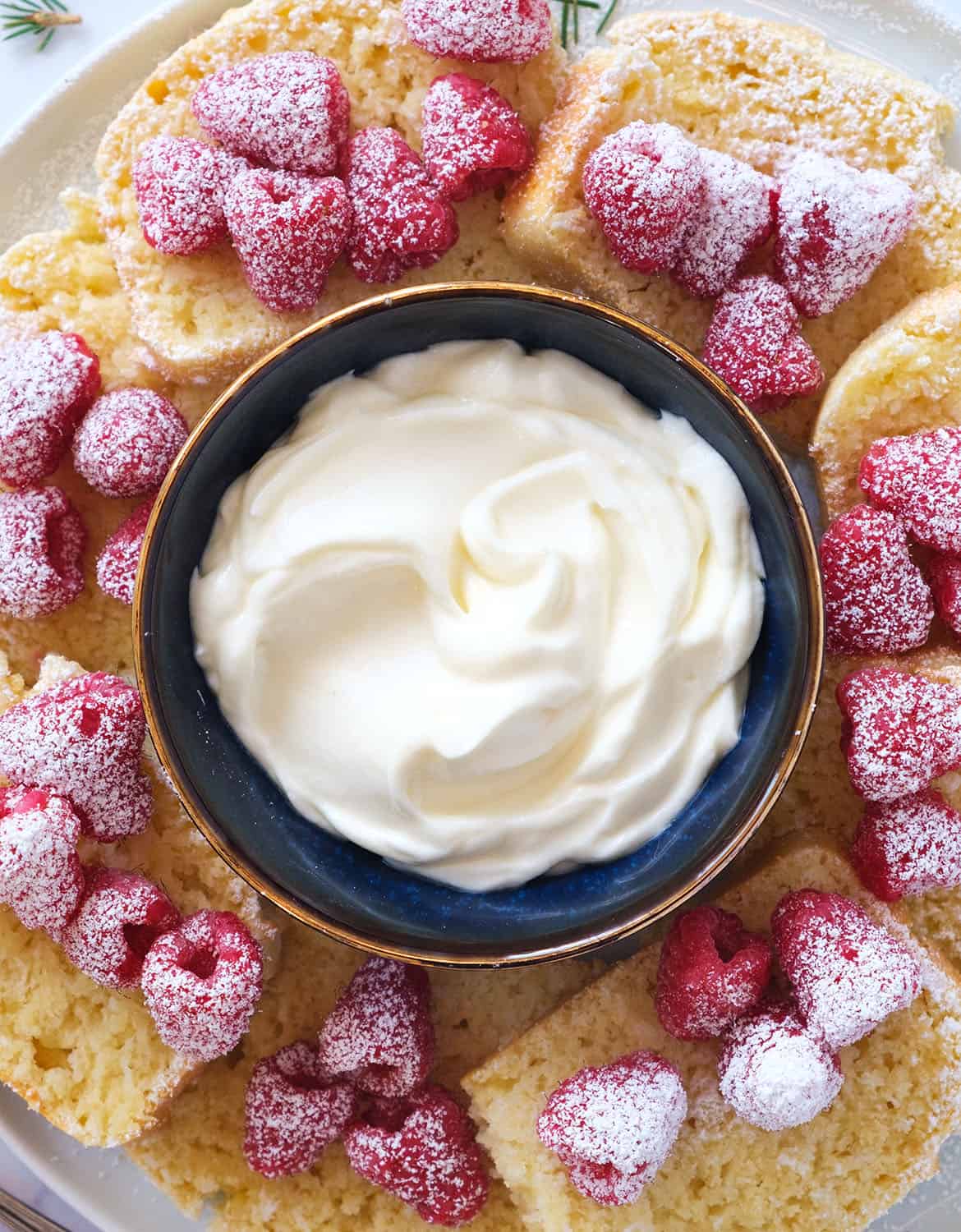 Top view of a small blue bowl full of sweet cream cheese recipe.