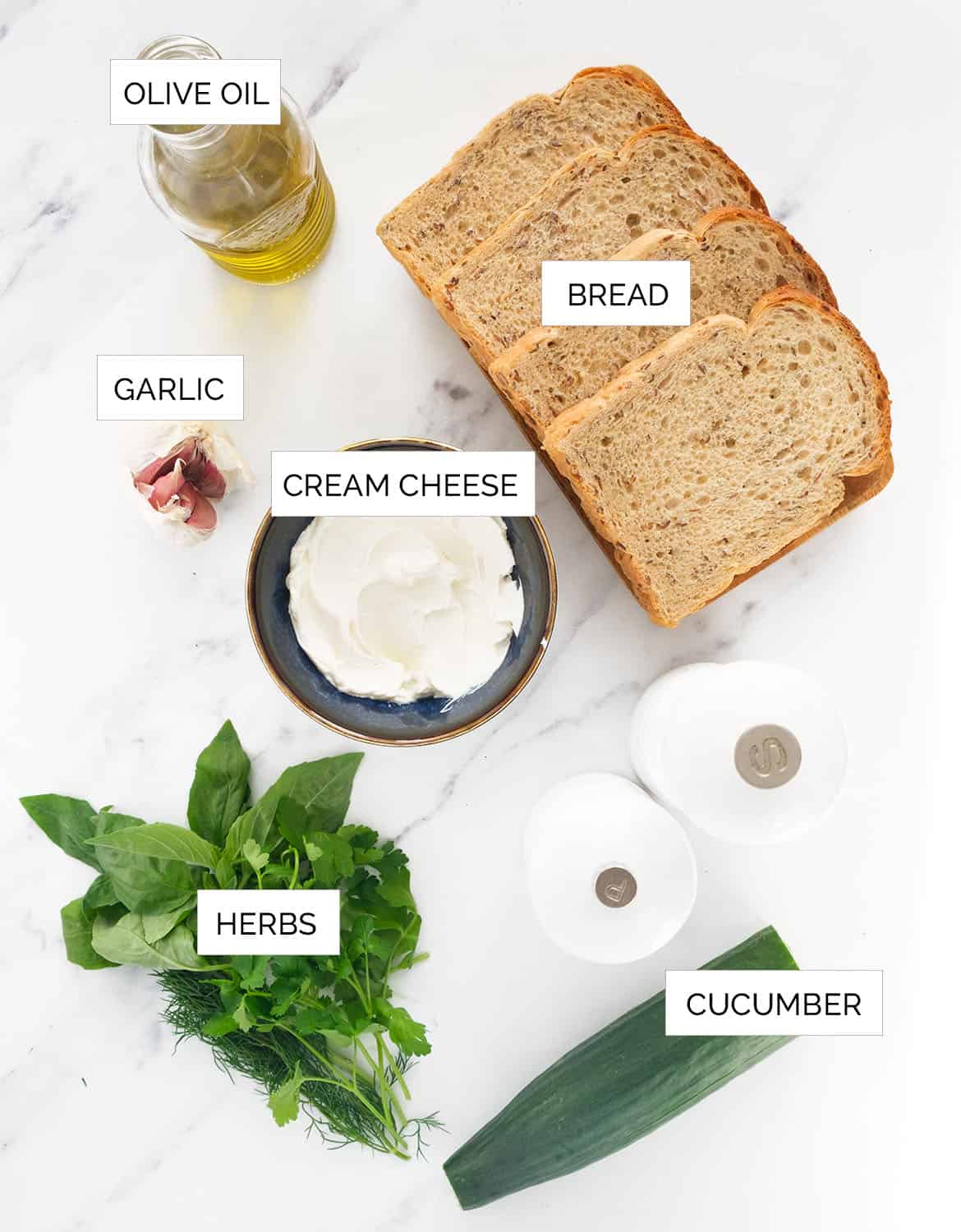 The ingredients to make this cream cheese sandwich are arranged over a white background.