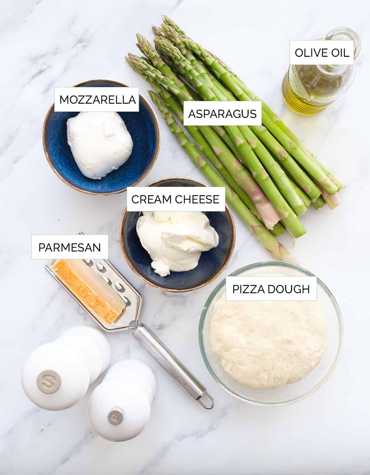Top view of the ingredients to make this asparagus pizza.