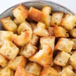Top view of some croutons made in a pan.
