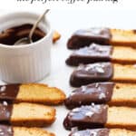 Close-up of several chocolate biscotti over a white background.
