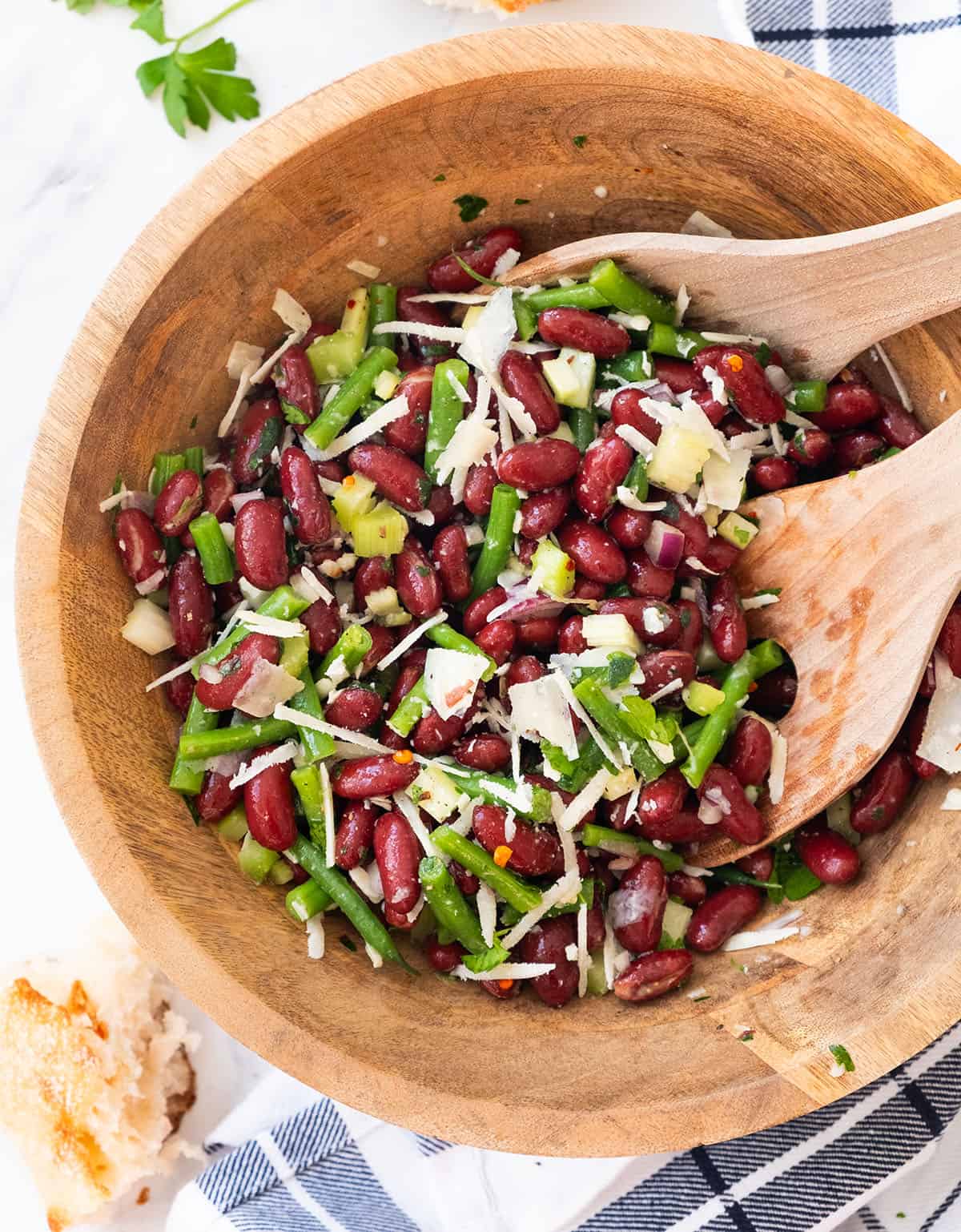 Top view of wooden bowl full of red bean salad.
