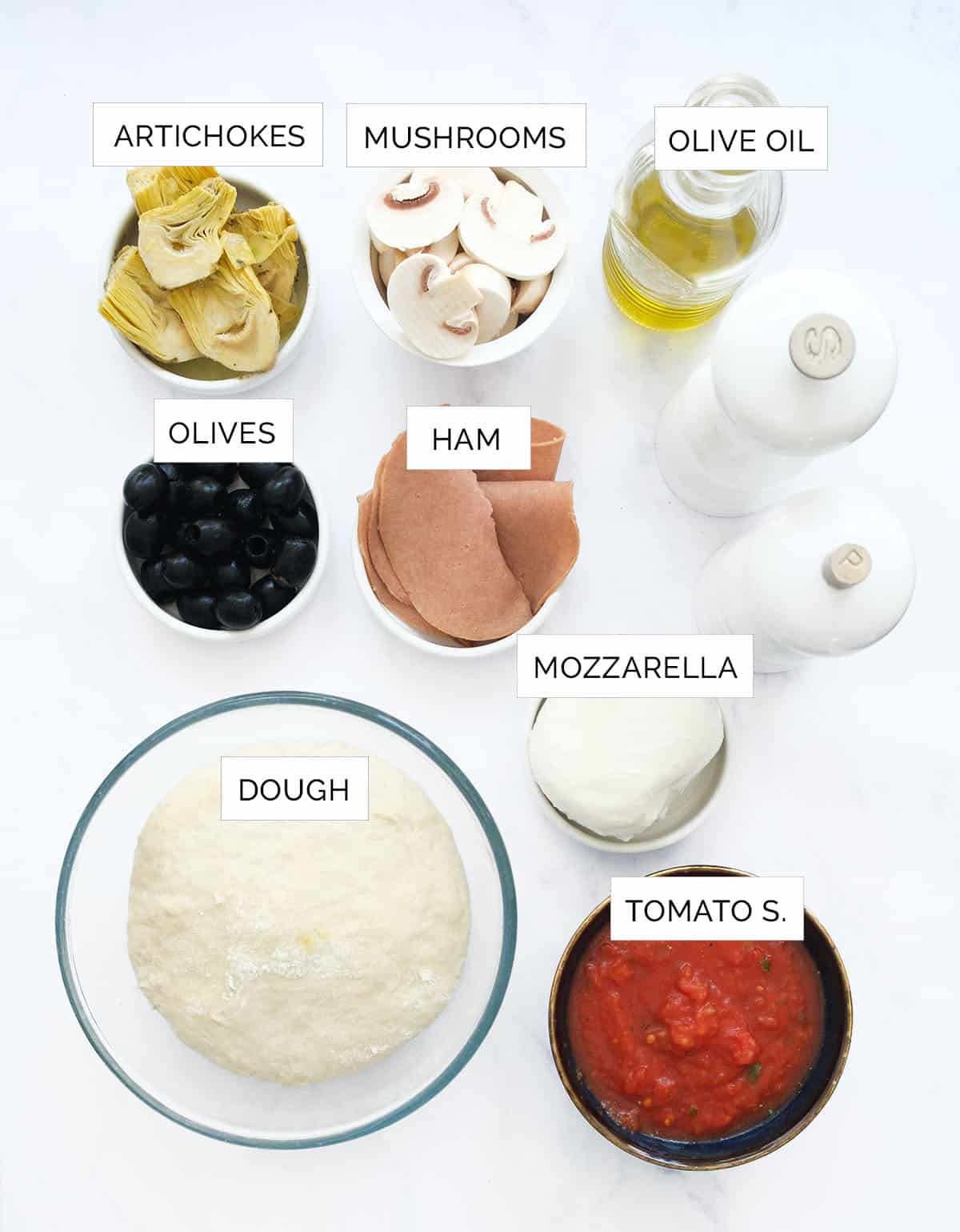 The ingredients to make the capricciosa pizza are arranged over a white background.