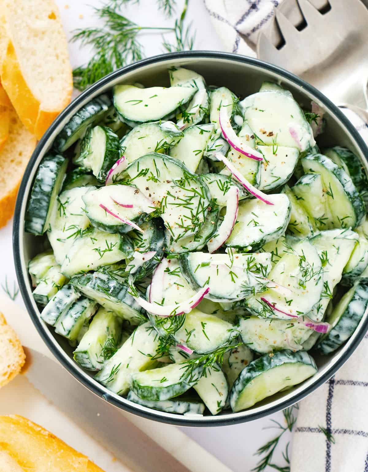 Top view of a bowl full of cucumber dill salad.