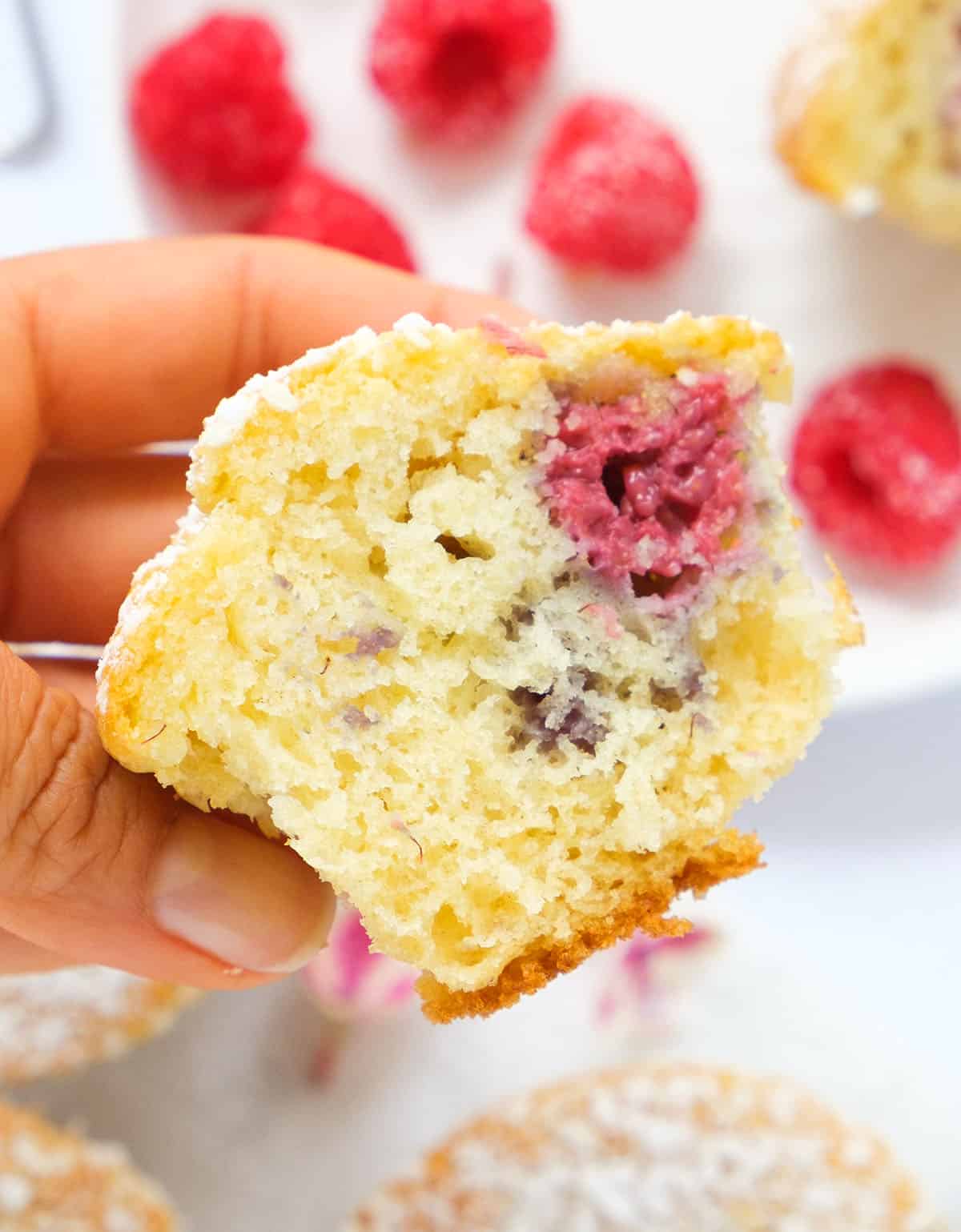Close-up of a half muffin with raspberries/